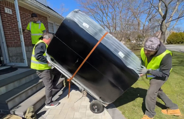 New oil tank being delivered to a Queens NY home
